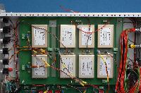 Photograph of the electronic circuitry of a lens power supply, created in a university workshop.  6 images.