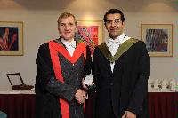 Photographs of Professor Arthur Trew giving an award to a graduate at the EPCC graduation, in the eScience Centre, on the 25th of November 2009.