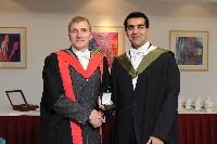 Photographs of Professor Arthur Trew giving an award to a graduate at the EPCC graduation, in the eScience Centre, on the 25th of November 2009.