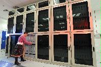A set of images of the QCDOC supercomputer.  This is a computer used solely for calculations related to Quantum Chromodynamics.  It is owned by a collaboration of UK lattice physicists UKQCD, Columbia University, Brookhaven National Laboratory and IBM.  16 images.