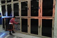 A set of images of the QCDOC supercomputer.  This is a computer used solely for calculations related to Quantum Chromodynamics.  It is owned by a collaboration of UK lattice physicists UKQCD, Columbia University, Brookhaven National Laboratory and IBM.  16 images.