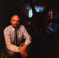 Photograph of a scientist with a jet engine. 2 images.