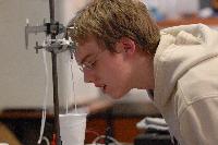 Photographs of Robert Dewar performing a superconductivity experiment, involving levitating magnets, during his 3rd Year Physics laboratories, January 2008.