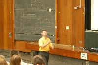 A set of photographs of Professor Simon Bates giving a lecture to a first year physics 1A class in 2005, possibly the first time PRS clickers were used.  Lecture hall was in Appleton tower.