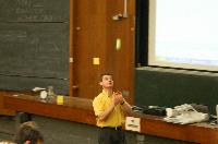 A set of photographs of Professor Simon Bates giving a lecture to a first year physics 1A class in 2005, possibly the first time PRS clickers were used.  Lecture hall was in Appleton tower.