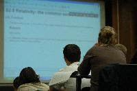 A set of photographs of Professor Simon Bates giving a lecture to a first year physics 1A class in 2005, possibly the first time PRS clickers were used.  Lecture hall was in Appleton tower.