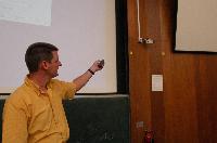A set of photographs of Professor Simon Bates giving a lecture to a first year physics 1A class in 2005, possibly the first time PRS clickers were used.  Lecture hall was in Appleton tower.