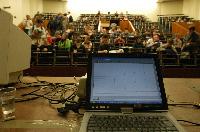 A set of photographs of Professor Simon Bates giving a lecture to a first year physics 1A class in 2005, possibly the first time PRS clickers were used.  Lecture hall was in Appleton tower.