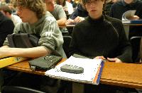 A set of photographs of Professor Simon Bates giving a lecture to a first year physics 1A class in 2005, possibly the first time PRS clickers were used.  Lecture hall was in Appleton tower.