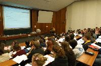 A set of photographs of Professor Simon Bates giving a lecture to a first year physics 1A class in 2005, possibly the first time PRS clickers were used.  Lecture hall was in Appleton tower.