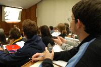 A set of photographs of Professor Simon Bates giving a lecture to a first year physics 1A class in 2005, possibly the first time PRS clickers were used.  Lecture hall was in Appleton tower.