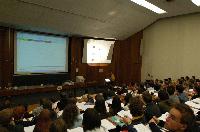 A set of photographs of Professor Simon Bates giving a lecture to a first year physics 1A class in 2005, possibly the first time PRS clickers were used.  Lecture hall was in Appleton tower.