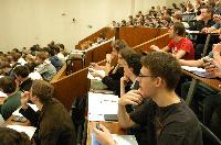 A set of photographs of Professor Simon Bates giving a lecture to a first year physics 1A class in 2005, possibly the first time PRS clickers were used.  Lecture hall was in Appleton tower.