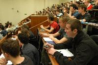 A set of photographs of Professor Simon Bates giving a lecture to a first year physics 1A class in 2005, possibly the first time PRS clickers were used.  Lecture hall was in Appleton tower.