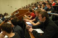 A set of photographs of Professor Simon Bates giving a lecture to a first year physics 1A class in 2005, possibly the first time PRS clickers were used.  Lecture hall was in Appleton tower.