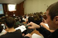 A set of photographs of Professor Simon Bates giving a lecture to a first year physics 1A class in 2005, possibly the first time PRS clickers were used.  Lecture hall was in Appleton tower.