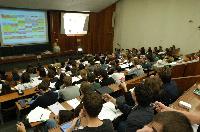 A set of photographs of Professor Simon Bates giving a lecture to a first year physics 1A class in 2005, possibly the first time PRS clickers were used.  Lecture hall was in Appleton tower.