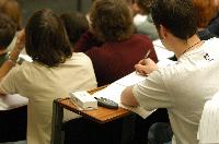 A set of photographs of Professor Simon Bates giving a lecture to a first year physics 1A class in 2005, possibly the first time PRS clickers were used.  Lecture hall was in Appleton tower.
