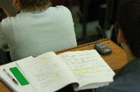 A set of photographs of Professor Simon Bates giving a lecture to a first year physics 1A class in 2005, possibly the first time PRS clickers were used.  Lecture hall was in Appleton tower.
