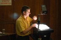 A set of photographs of Professor Simon Bates giving a lecture to a first year physics 1A class in 2005, possibly the first time PRS clickers were used.  Lecture hall was in Appleton tower.
