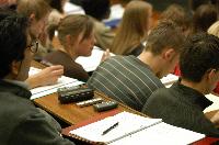 A set of photographs of Professor Simon Bates giving a lecture to a first year physics 1A class in 2005, possibly the first time PRS clickers were used.  Lecture hall was in Appleton tower.