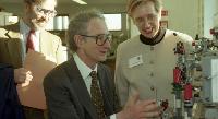 A visit by an unknown man to the University of Edinburgh Chemistry Department, accompanied by Dr. Sabine Flitsch and Professor Geoffrey S. Boulton.  2 images.