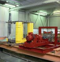 Two men set up an experiment in a water tank for what is likely a fluid dynamics experiment.  A laser is used in the water - possibly for particle image velocimetry / PIV.  What looks like an oil platform is set up above the water for some unknown testing.  10 images.
