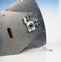 A set of photographs of a fluid dynamics experiment where a rudder / wing is placed into a wind tunnel.  Also shown are the unknown pieces of equipment involved. 6 images.