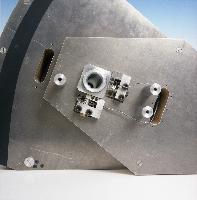 A set of photographs of a fluid dynamics experiment where a rudder / wing is placed into a wind tunnel.  Also shown are the unknown pieces of equipment involved. 6 images.