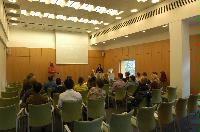 Photographs of a lecture on a planetary science entitled: 'Quaoar, crystalline water ice and all that...' by Helen Brand (UCL) and Helen Maynard (CSEC, UoE). Dr John Loveday is present as possibly the supervisor. The photographs were taken for a brochure in November 2005.