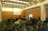 Photographs of a lecture on a planetary science entitled: 'Quaoar, crystalline water ice and all that...' by Helen Brand (UCL) and Helen Maynard (CSEC, UoE). Dr John Loveday is present as possibly the supervisor. The photographs were taken for a brochure in November 2005.