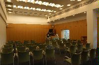 Photographs of a lecture on a planetary science entitled: 'Quaoar, crystalline water ice and all that...' by Helen Brand (UCL) and Helen Maynard (CSEC, UoE). Dr John Loveday is present as possibly the supervisor. The photographs were taken for a brochure in November 2005.