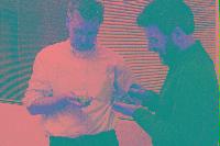 A collection of photographs showing people preparing for the NeSC opening in April 2002.