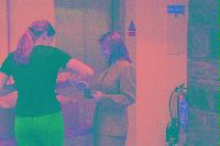 A collection of photographs showing people preparing for the NeSC opening in April 2002.