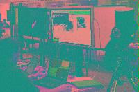 A collection of photographs showing people preparing for the NeSC opening in April 2002.