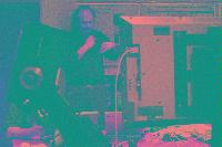 A collection of photographs showing people preparing for the NeSC opening in April 2002.