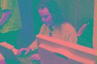 A collection of photographs showing people preparing for the NeSC opening in April 2002.