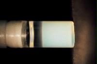 A sequence of photos showing the crystallization and then sedimentation of 2 substances.