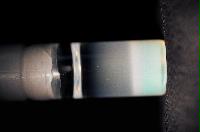 A sequence of photos showing the crystallization and then sedimentation of 2 substances.