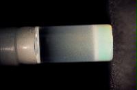 A sequence of photos showing the crystallization and then sedimentation of 2 substances.