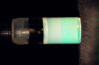 A sequence of photos showing the crystallization and then sedimentation of 2 substances.