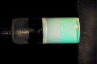 A sequence of photos showing the crystallization and then sedimentation of 2 substances.