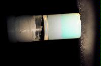 A sequence of photos showing the crystallization and then sedimentation of 2 substances.