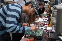 A set of photographs of Martin Reekie and Susan Kivlins in an electronics workshop / laboratory session on 28th November 2008.