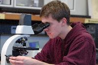 Photographs of Diarmuid Lloyd performing an experiment on Brownian motion (seemingly random movement of particles suspended in a fluid), during his 3rd Year Physics Laboratories, January 2008.