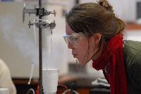Photographs of Hilary Singer performing a superconductivity experiment, involving levitating magnets, during her 3rd Year Physics laboratories, January 2008. In some of the pictures it is possible to see her lab partner, Robert Dewar, in the background.