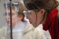 Photographs of Hilary Singer performing a superconductivity experiment, involving levitating magnets, during her 3rd Year Physics laboratories, January 2008. In some of the pictures it is possible to see her lab partner, Robert Dewar, in the background.