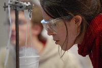 Photographs of Hilary Singer performing a superconductivity experiment, involving levitating magnets, during her 3rd Year Physics laboratories, January 2008. In some of the pictures it is possible to see her lab partner, Robert Dewar, in the background.