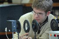 Photographs of Oliver Proctor performing an experiment on the Zeeman effect (using a static magnetic field to split a spectral line into components) during his 3rd Year Physics laboratories, January 2008.
